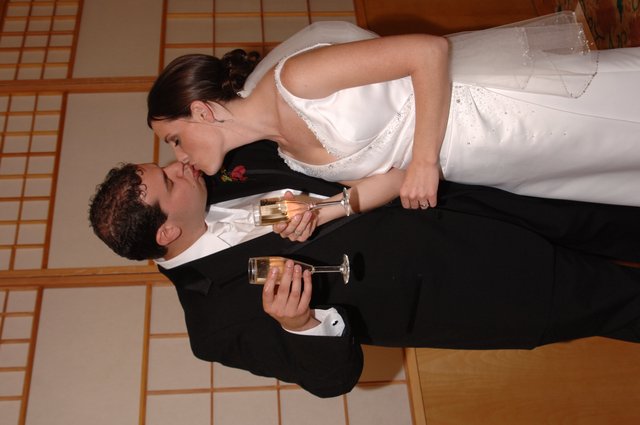 Newlyweds Share a Kiss and Champagne Toast