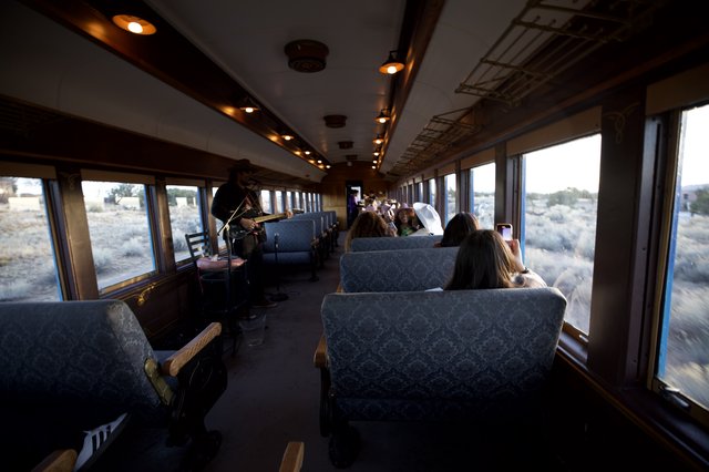 Vintage Train Journey Through Desert Landscape with Violinist