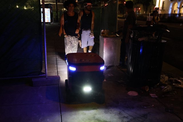 Autonomous Delivery Robot Navigates Nighttime Festival Crowd