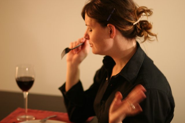 Woman Dining with Red Wine at Intimate Dinner