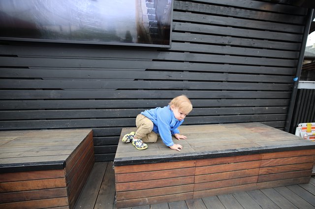 Toddler Climbing Modern Wooden Deck Stairs