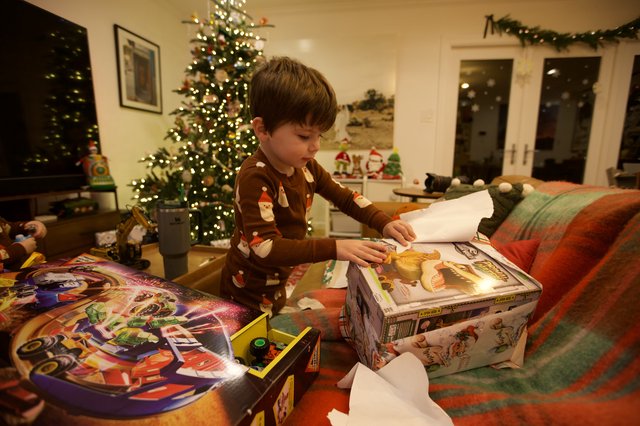 Christmas Morning: Child Opening Presents