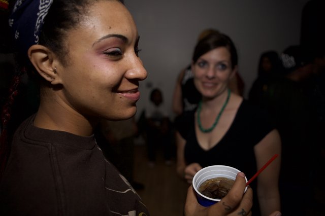 Two Women Smiling at a Late-Night Dubstep Event