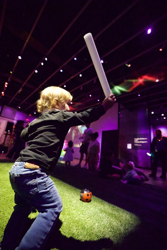 Young Child Playing Cricket at Baby Rave Event