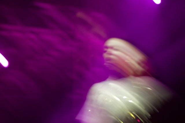 Blurred Spotlight on a Concertgoer