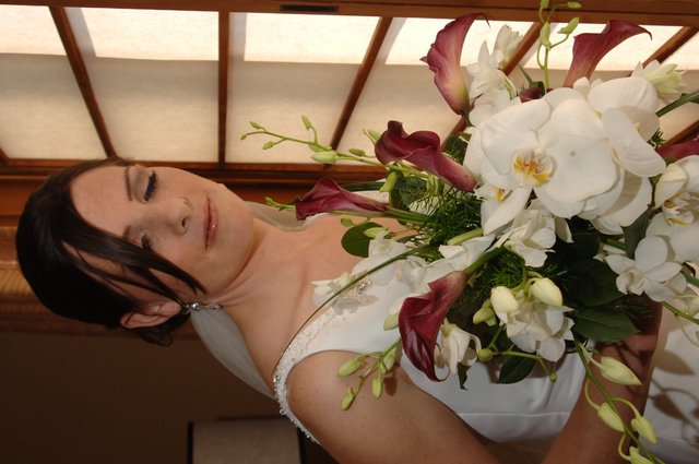 Bride with Bouquet Gazing Softly by Window