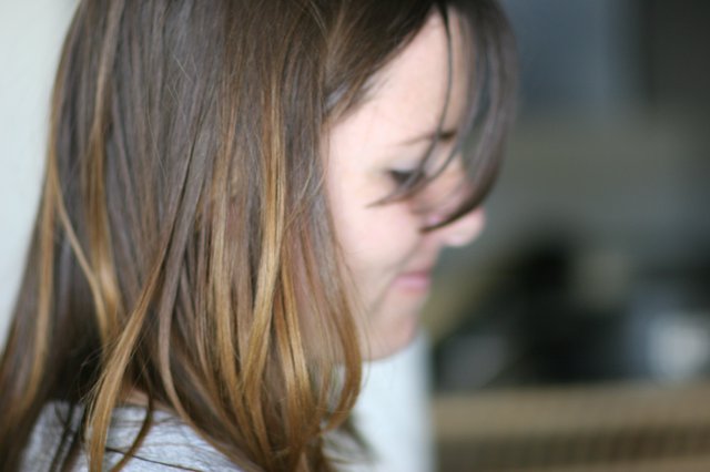 Young Girl Lost in Thought, Hair Falling Forward