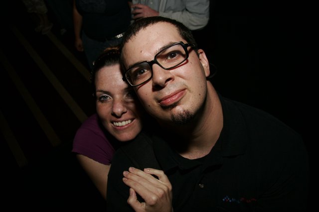 Couple Poses Together at Late Night Event