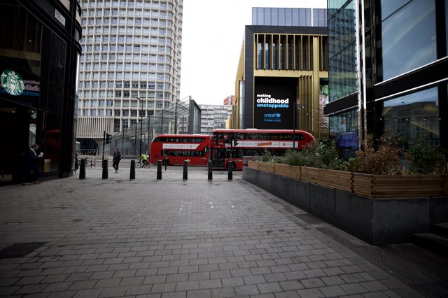 Modern London Plaza with Red Double-Decker Bus