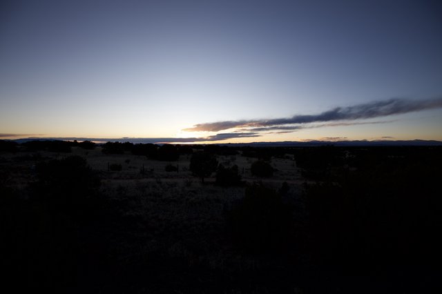 Desert Twilight Under Dramatic Cloud Formation