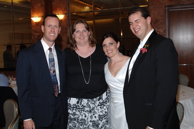 Joyful Wedding Reception Celebration with Four Guests