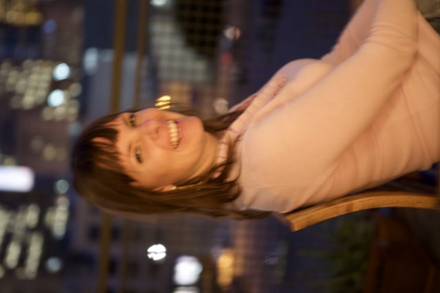 Joyful Woman Laughing at Night in the City