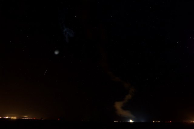 Rocket Blazes Through Starry Night Sky