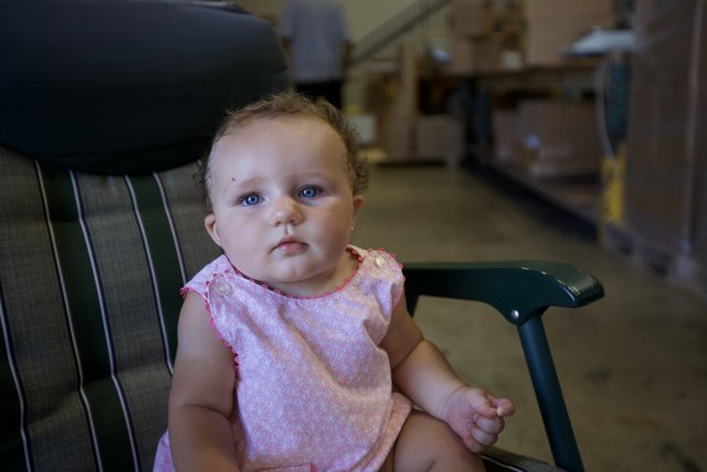 Baby in a Warehouse Chair
