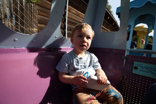 Toddler at Colorful Playground in Fantasyland