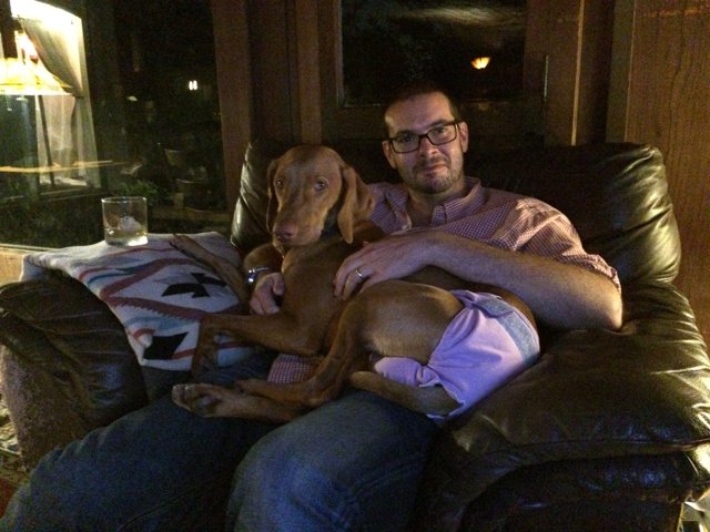 Man and Puppy Enjoying a Cozy Evening at Home