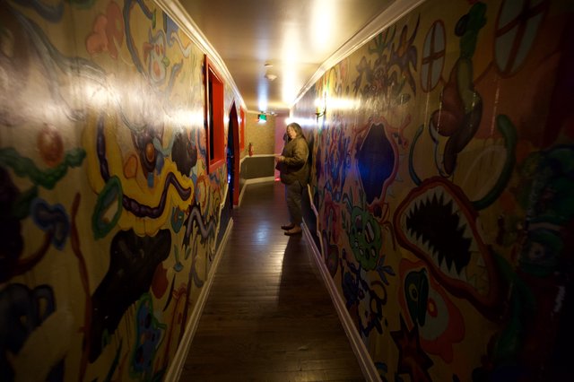 Vibrant Graffiti-Style Murals in Colorful Hallway