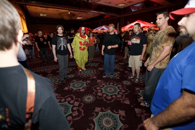Partygoers gather around clown for a night of fun