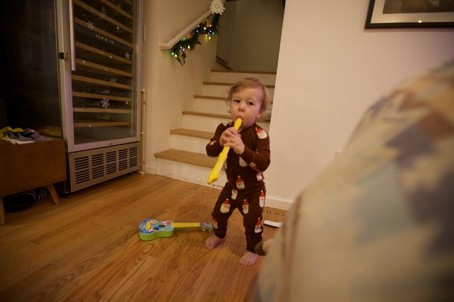 Toddler Playing Yellow Recorder on Christmas Day