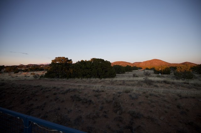 Desert Sunset Over Hills and Scrubland
