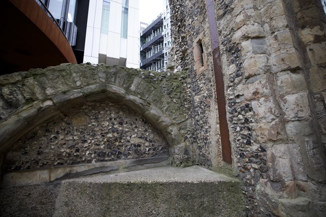 Ancient Roman Wall Ruins Amid Modern London Architecture