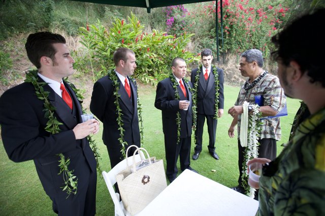 Groomsmen in Suits with Flower Bouquets