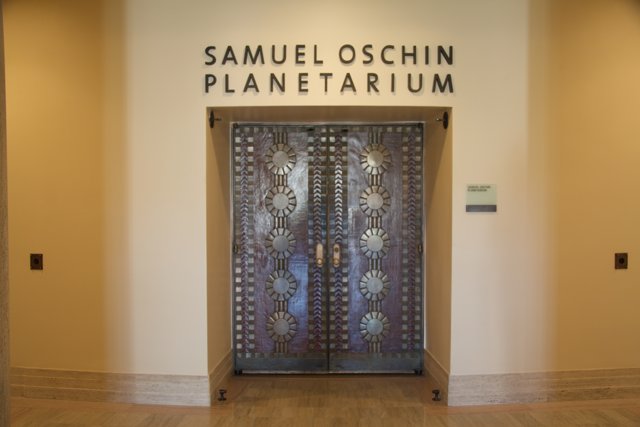Samuel Oshin Planetarium's stylish wooden doorway