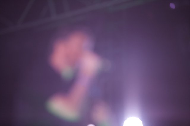 Blurred Lights and Energetic Performer