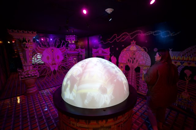 Illuminated Art Installation in Fantastical Purple Gallery
