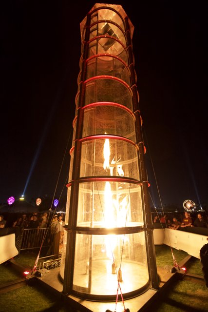 Tower Engulfed in Flames at Night