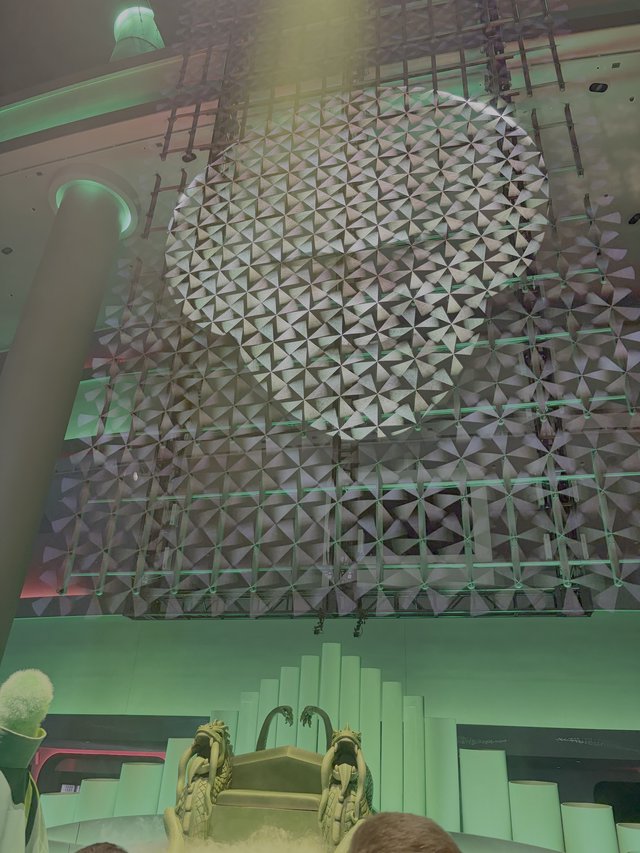 Futuristic Geometric Ceiling Installation with Green Lighting