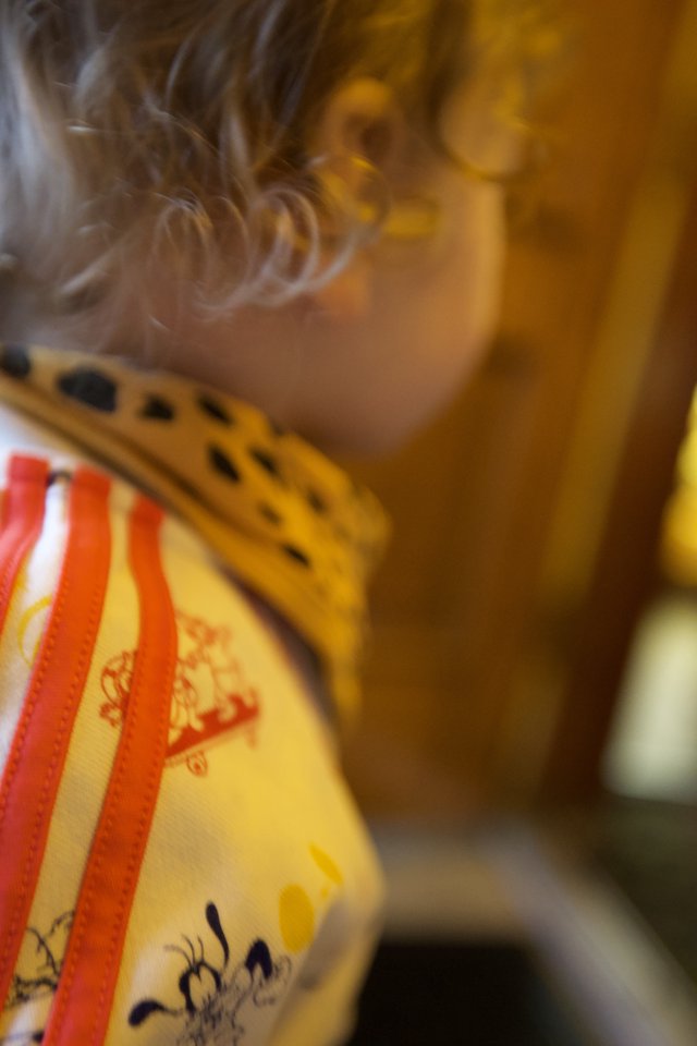 Child Playing Traditional Chinese Musical Instrument Close-Up