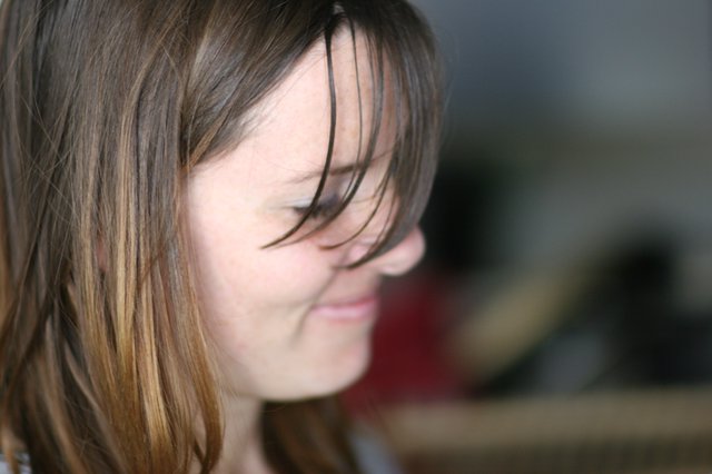 Windswept Hair Across a Gentle Smile