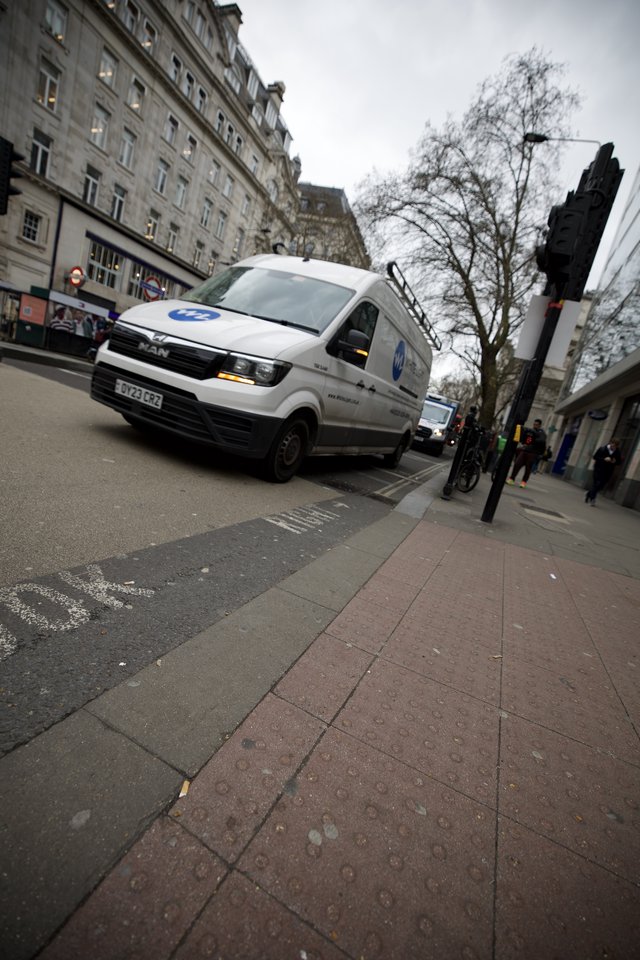 White Delivery Van on London Street Corner