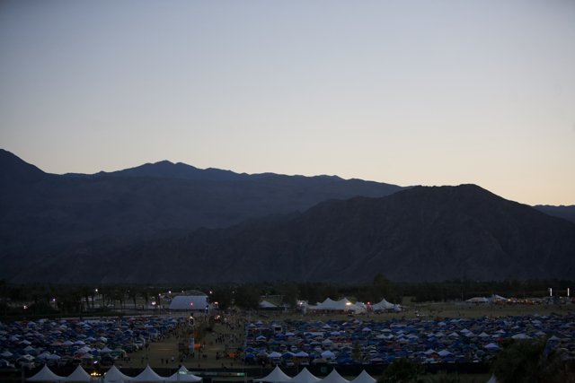 Majestic Mountains and Camping Tents at Dusk