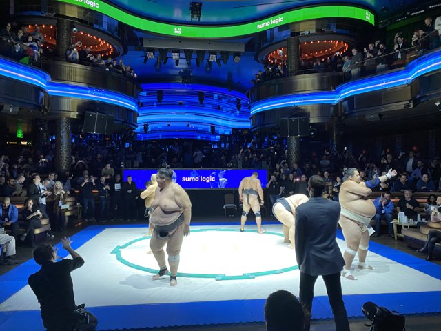Sumo Wrestling Fans Watch the Action on the Big Screen