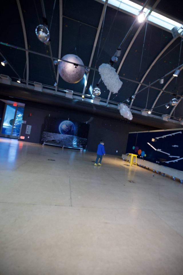 Child Explores Planetary Exhibition at Science Museum