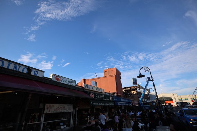 Bustling Fisherman's Wharf Seafood Market at Dusk