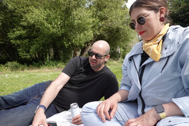 Couple Relaxing in Sunny Park Setting