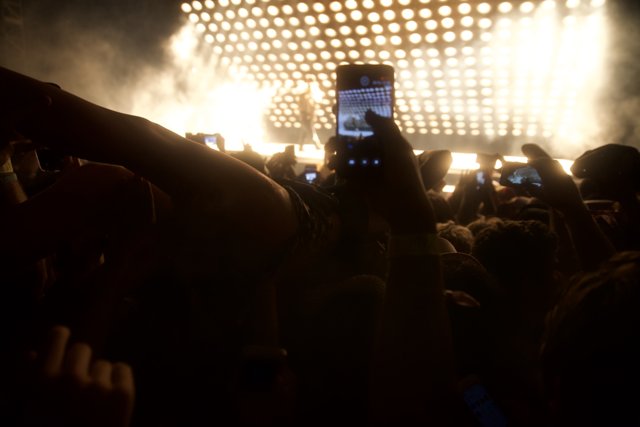 Phone-Wielding Crowd at Rock Concert