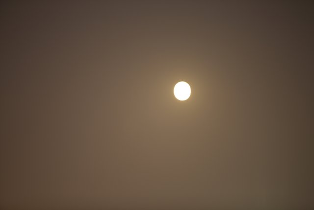 Majestic Full Moon Shrouded in Fog