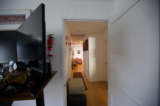 Modern Apartment Hallway Leading to Cozy Living Space