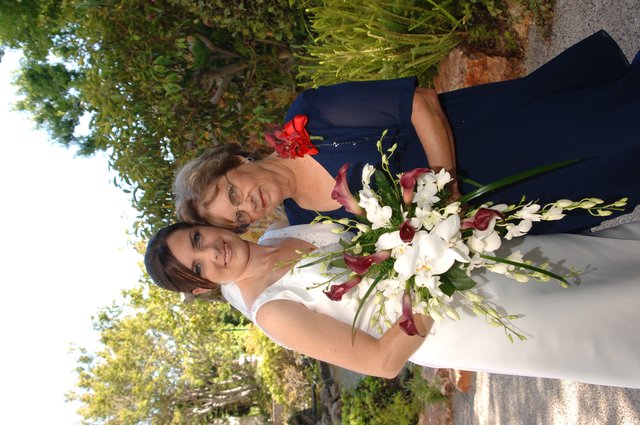 Bride and Elder Woman Share Wedding Day Bouquet