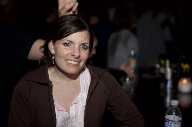 Woman Smiling at Nightclub Event in 2007