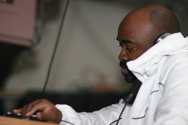 White-Jacketed Man with Headphones