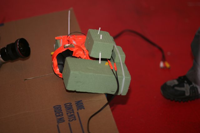 Boy Holding Mysterious Box with Wires