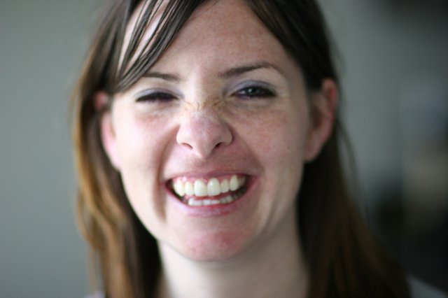 Joyful Woman with Freckles Laughing Candidly