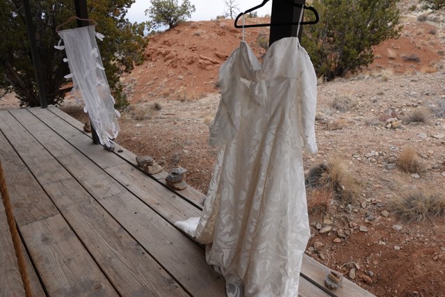 Elegant Wedding Gown on Wooden Porch