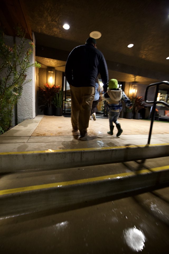 Father and Child Walking Home on Winter Evening
