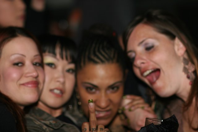Four Friends Celebrating at a Nightclub Party